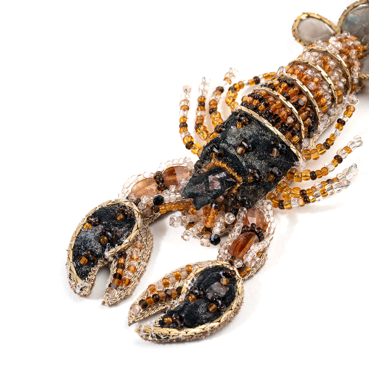 Detail of Deepa Gurnani handmade Lobster brooch in brown color