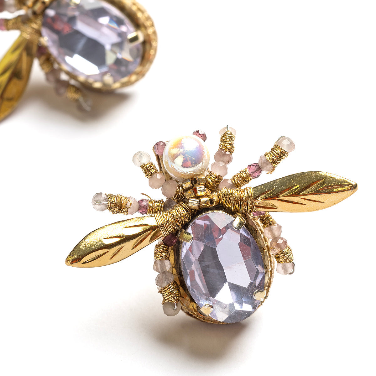 Detail of Deepa Gurnani handmade the Firefly earrings in Lavender color